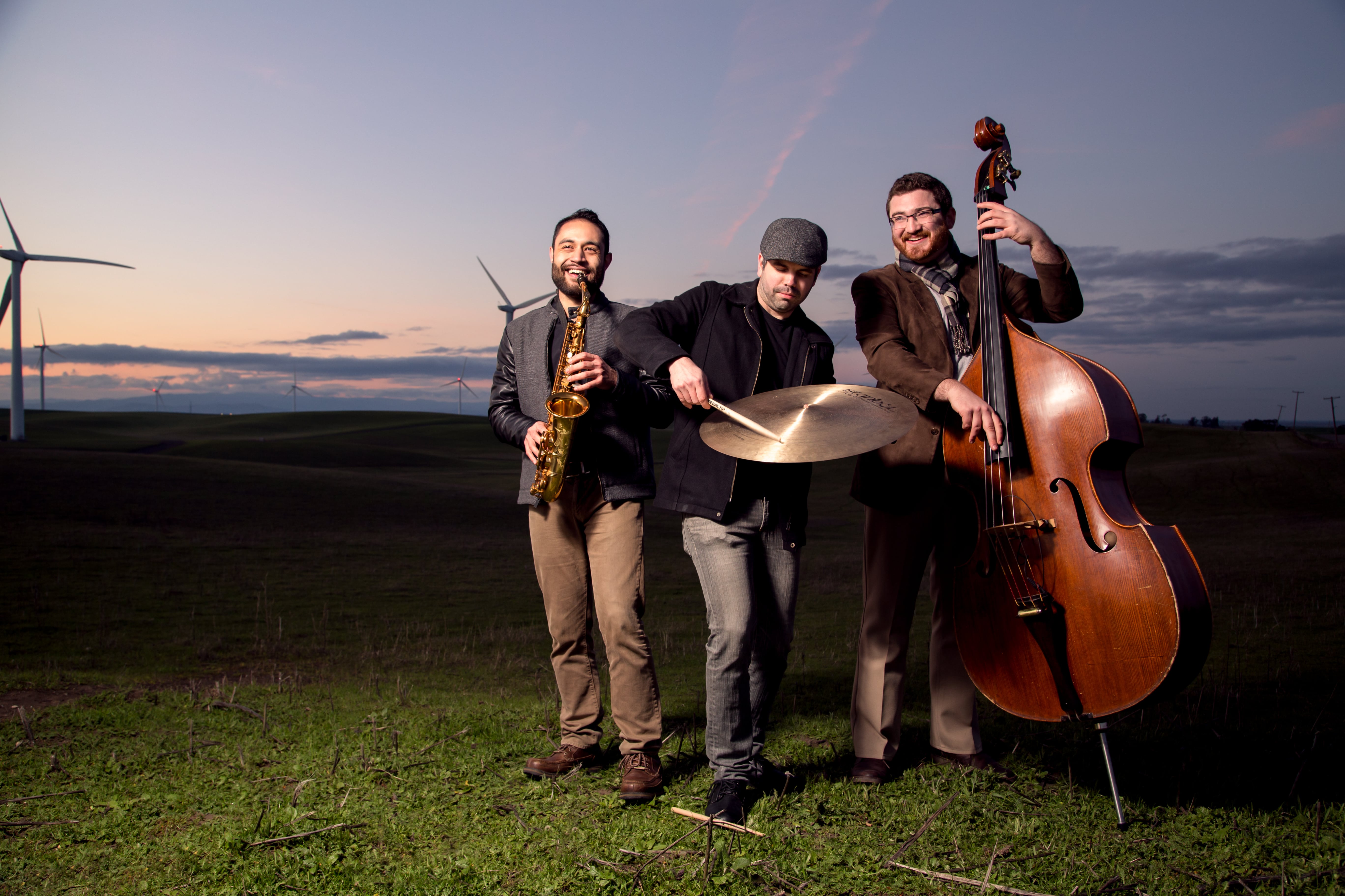 Photo of the band Triism holding instruments.